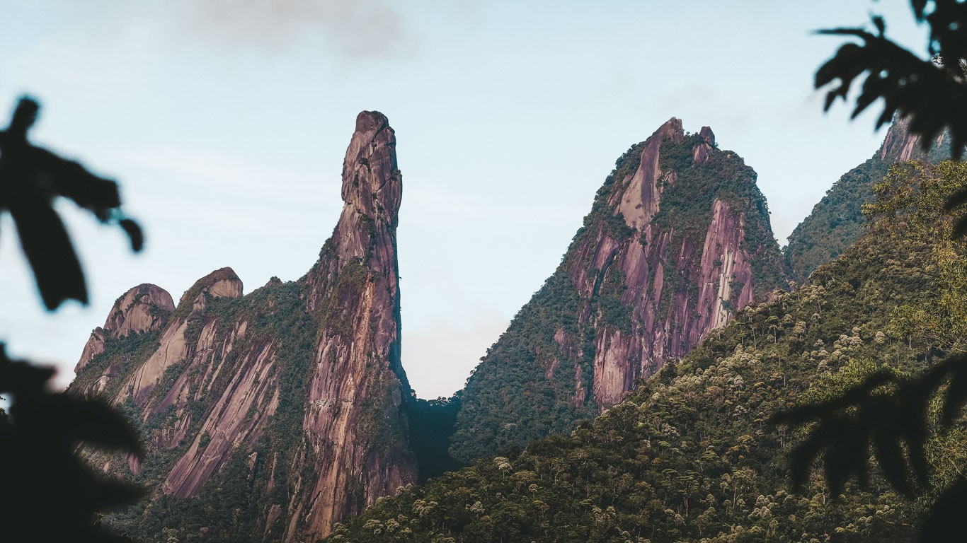 View of the Serra dos Órgãos in Teresópolis, Rio de Janeiro, showcasing the dramatic mountain peaks and lush greenery that characterize this iconic natural landscape.