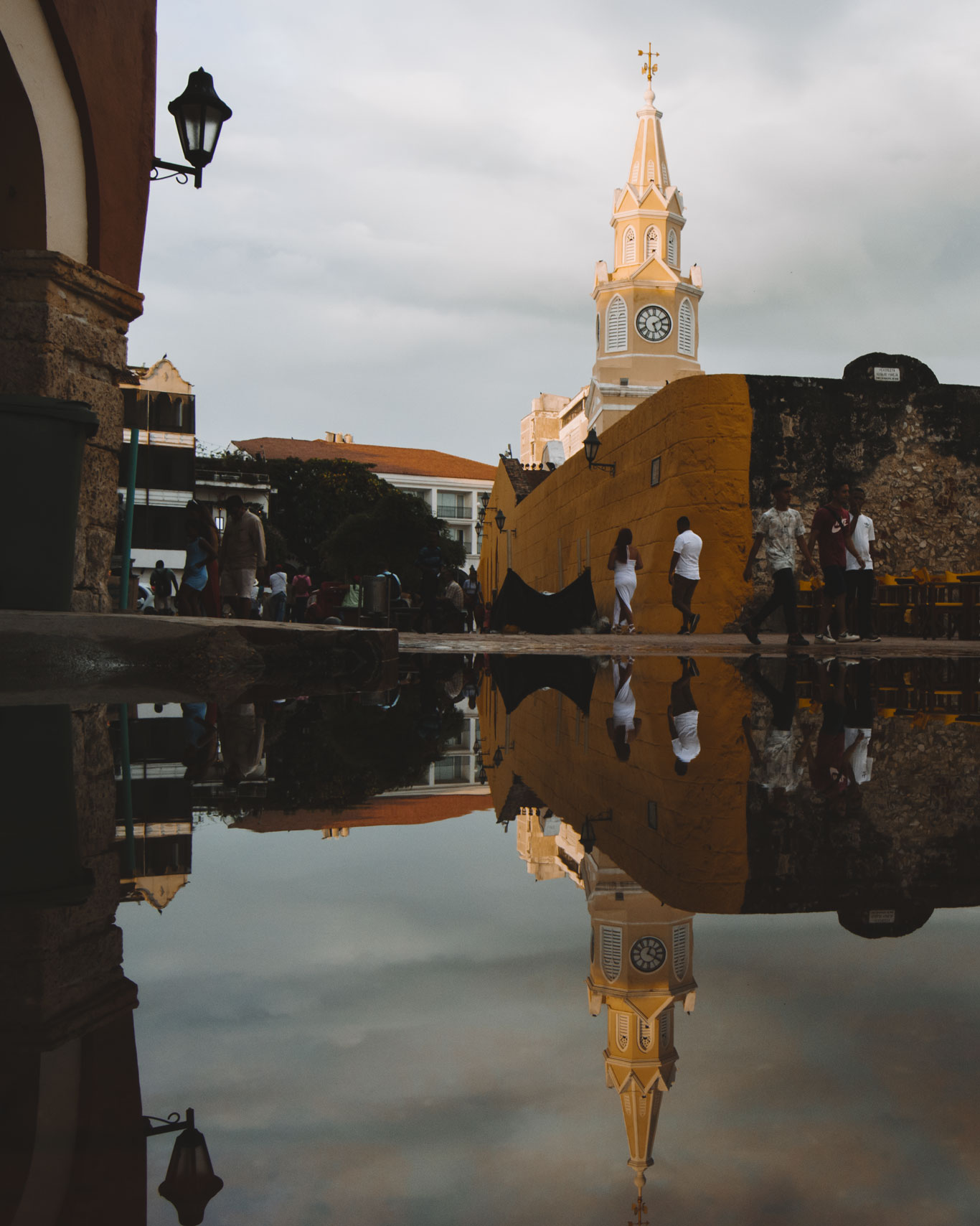 Clock Tower, in the historic center of Cartagena. The tower is reflected in the rainwater.