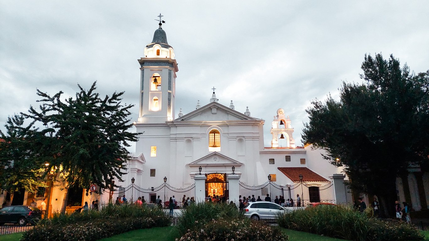 Basílica-Nuestra-Senora-del-Pilar Evening view of the illuminated white façade of the Basílica Nuestra Señora del Pilar in Recoleta — visiting this historic church is among the peaceful and cultural things to do in Buenos Aires.