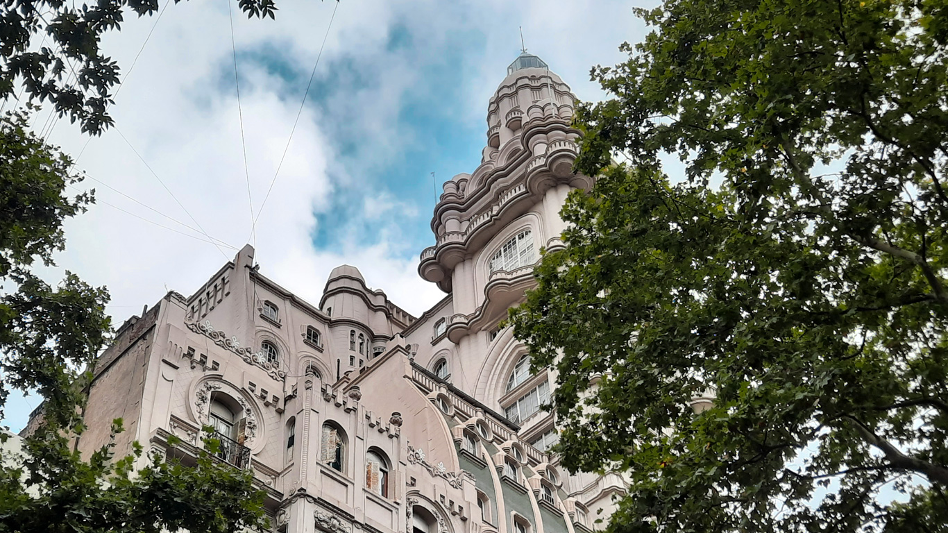 barolo-palace Looking up at the ornate and symbolic Barolo Palace through lush green trees, this uniquely designed building is inspired by Dante’s Divine Comedy and is a popular architectural highlight among the things to do in Buenos Aires.