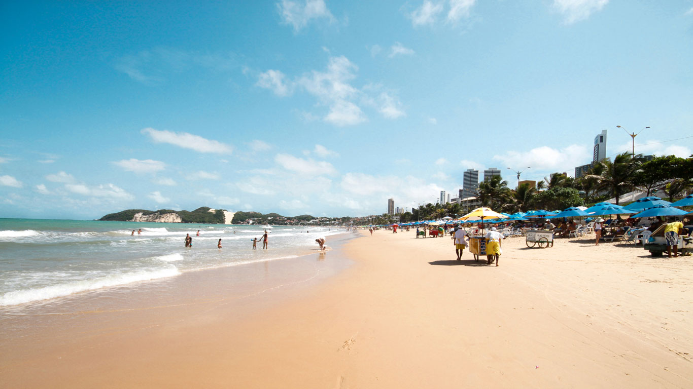 ponta-negra-natal Bustling Ponta Negra Beach in Natal, Brazil, a top recommendation when searching where to stay in Natal for easy beach access and local amenities.